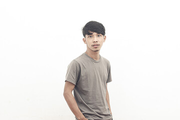 portrait of asian youth wearing gray t-shirt in cool style