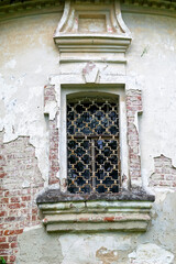 antique window in a brick wall