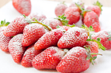 Fresh and natural garden strawberries on a white plat