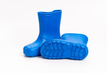 blue rubber boots on a white background. shoes for rainy weather and puddles.