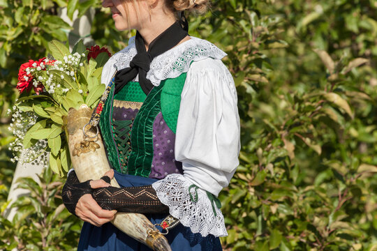A girl in typical costume during an autumn local celebration in Val Isarco ( South Tyrol )