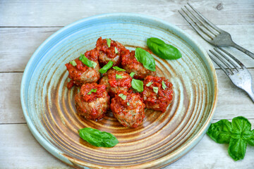 Tasty home made    italian  dish mini  meatballs baked in marinara tomato  sauce