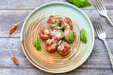 Tasty home made    italian  dish mini  meatballs baked in marinara tomato  sauce