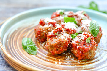 Tasty home made    italian  dish mini  meatballs baked in marinara tomato  sauce