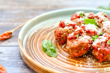 Tasty home made    italian  dish mini  meatballs baked in marinara tomato  sauce