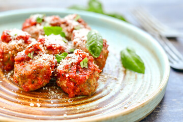 Tasty home made    italian  dish mini  meatballs baked in marinara tomato  sauce
