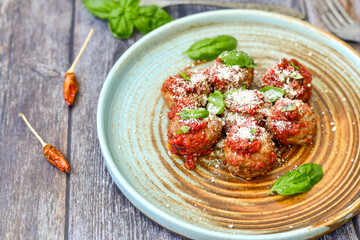 Tasty home made    italian  dish mini  meatballs baked in marinara tomato  sauce