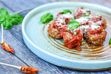 Tasty home made    italian  dish mini  meatballs baked in marinara tomato  sauce