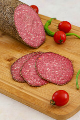 Italian salami on wooden background. beef salami