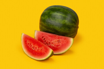 Watermelon with slices on a yellow background
