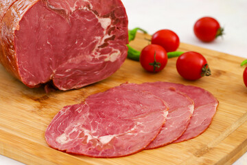 Smoked beef entrecote on wooden background. smoked beef loin slices