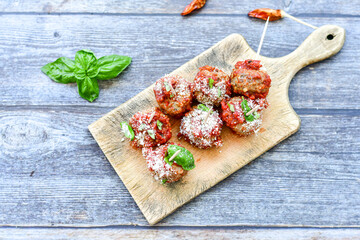 Tasty home made    italian  dish mini  meatballs baked in marinara tomato  sauce