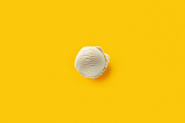 Ball of white ice cream on yellow background