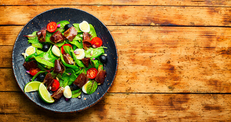 Spring salad with herbs and jerky