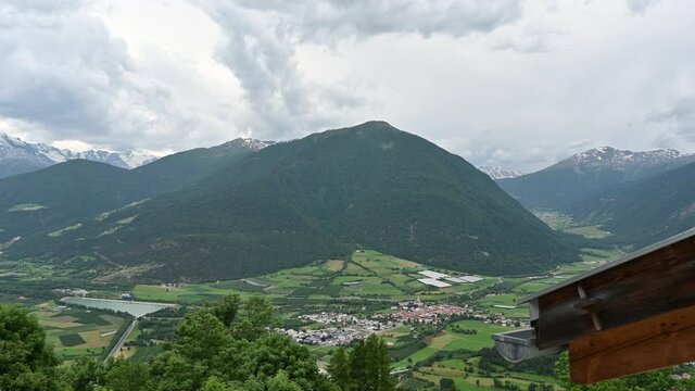 Malles Venosta, Trentino, Italy. Amazing panning footage of the valley. The medieval village of Glorenza is recognized, surrounded by protective walls. Typical mountain landscape, beautiful summer day