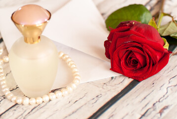 roses letter and bottle with perfume, love concept