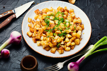 Fried potatoes with green onions