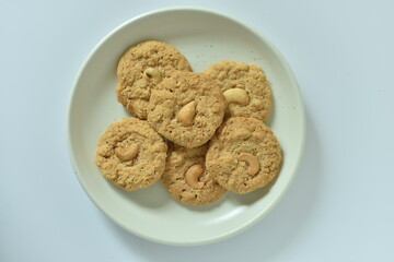 Bread Biscuits with Cashew Nuts on dish on white background..