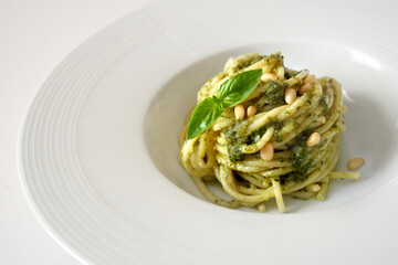 Pasta spaghetti with pesto genovese on white background
