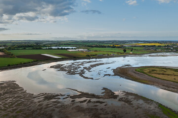 Irish textured landscape and water reflections at sunset.Rogerstown Estuary at sunset, aerial view.