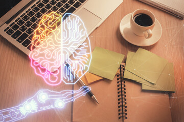 Double exposure of brain drawing hologram over topview work table background with computer. Concept of big data.