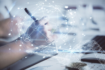 Double exposure of social network theme drawing over people taking notes background. Concept of...