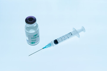 A bottle of Covid-19 (SARS-CoV-2) vaccine with a syringe needle