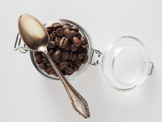 Coffee beans in a cup on a white background