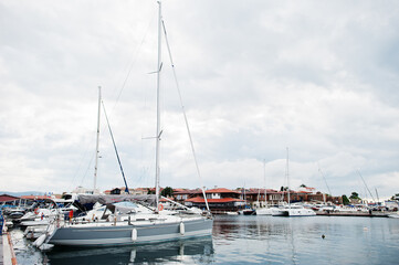  Marine parking of modern motor boats. Luxury yachts docked in sea port.
