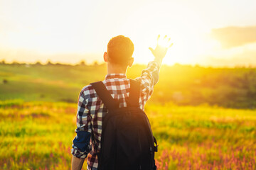 Back view, Human hand, tourist covering sunlight, Sun shining through hand, Human hand and sun,...