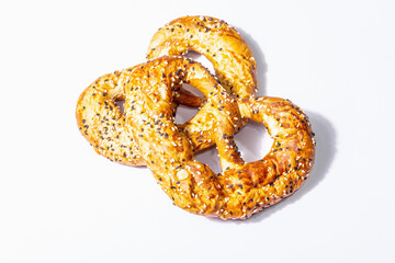 Oktoberfest concept - pretzels isolated on a white background. A trendy hard light, dark shadow