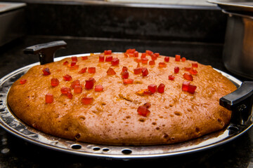Homemade cake baked traditionally without microwave oven prepared with biscuits and topped up with tutti frutti for a delicious flavour