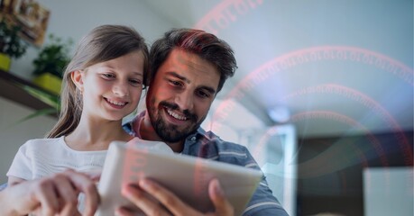 Fototapeta premium Binary coding data processing against caucasian father and daughter using digital tablet at home