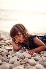 Cute little girl posing in front of a camera.