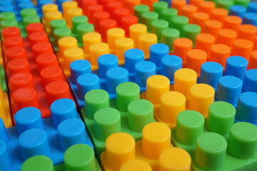 Plastic building blocks pattern background, Colored toy bricks for kid, Close up