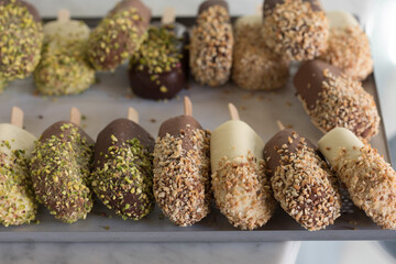 sweet brown and white chocolate cake popsicle dessert with toppings