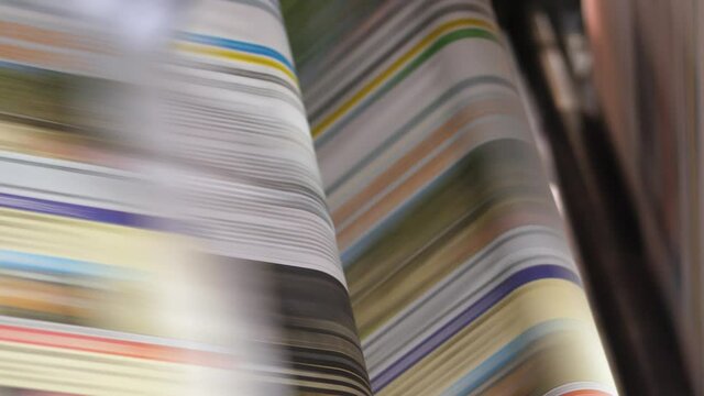 News print media roller machine cascade batch closeup