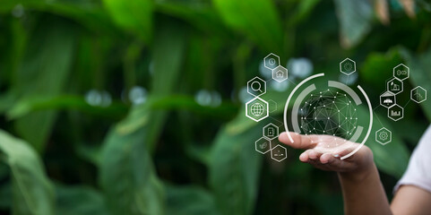 Technology, hand holding with environment Icons over the Network connection on green background.