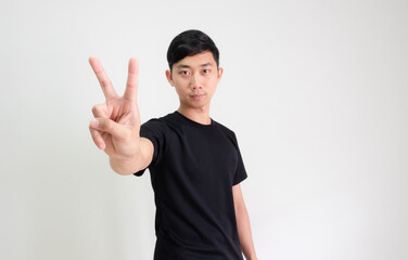Young Asian man black shirt count one to ten by hand half body on white isolated background,Man counting number concept