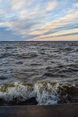 Naklejka na ściany i meble beautiful sunset and waves on the Volga River