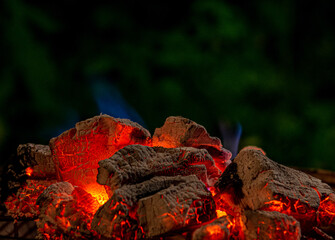 Burning coals from a fire abstract background