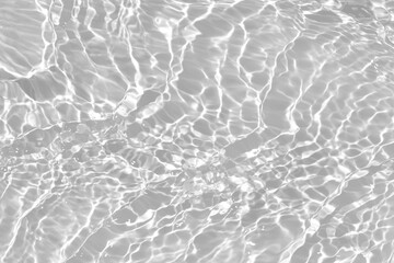Desaturated transparent clear calm water surface texture with ripples, splashes Abstract nature...