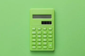 Green Calculator on Green background © liliya