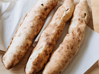 Lobiani - traditional Georgian red bean pie. Homemade pie on a wooden table. Local food in the mountains of Georgia