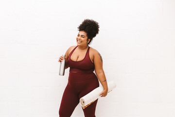 Naklejka premium Smiling health woman after yoga workout