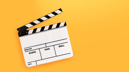 Movie clapperboard or film slate on yellow backgrounds.