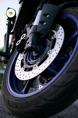Obraz premium View of the wheel of a sports motorcycle. Vertical concept.