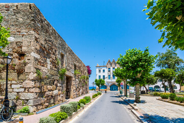 Ancient Roman Agora wall and colorful street view in Kos Town 