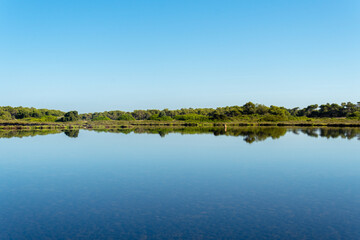 General view of Colonia de Sant Jordi town reflected