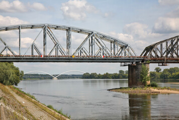 Fototapeta na wymiar Railroad bridge and Elzbieta Zawacka bridge in Torun. Poland